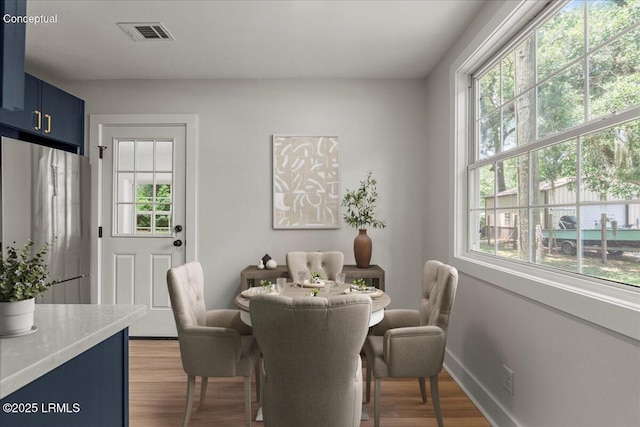 1807 Battery Park Dr, Port Royal, SC 29935 - dining area with light wood finished floors and baseboards