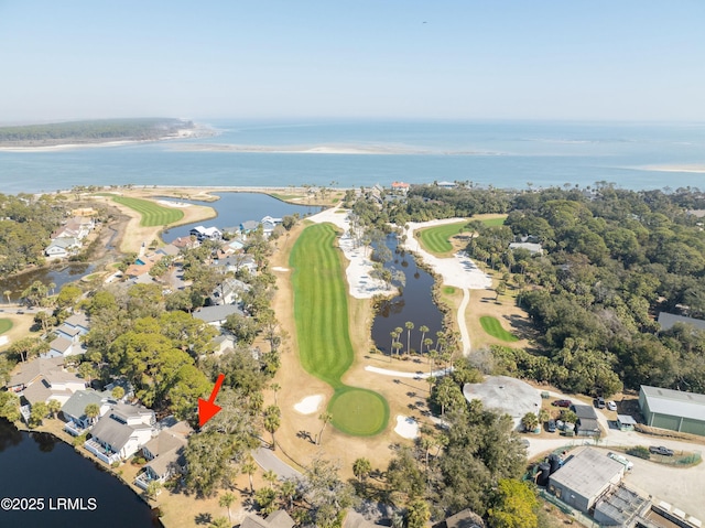 birds eye view of property with a water view and golf course view