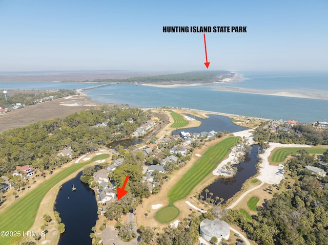 drone / aerial view featuring a water view and golf course view