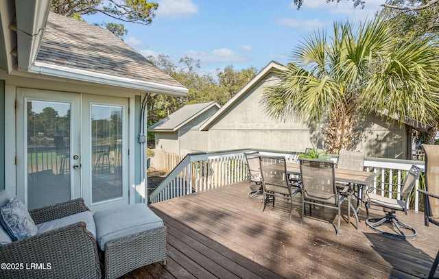 wooden deck featuring outdoor dining space