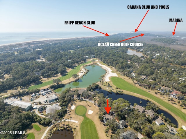 birds eye view of property with view of golf course and a water view