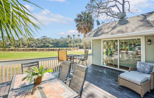 deck featuring a lawn