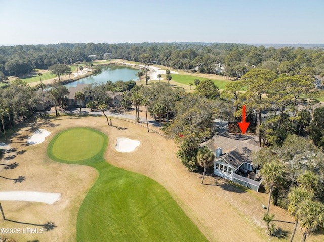 birds eye view of property with a water view and golf course view