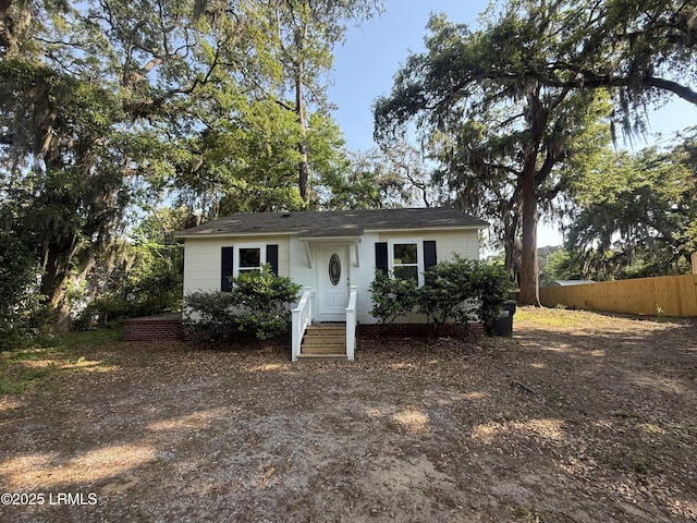 view of front of property featuring fence