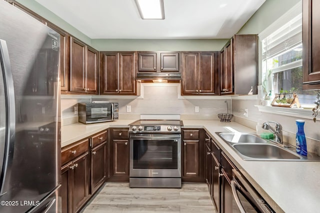 238 Turkey Oak Dr, Bluffton, SC 29910 - kitchen featuring under cabinet range hood, stainless steel appliances, light countertops, and a sink