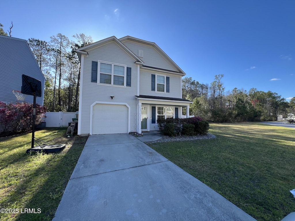 traditional-style home featuring concrete driveway, a front lawn, an attached garage, and fence