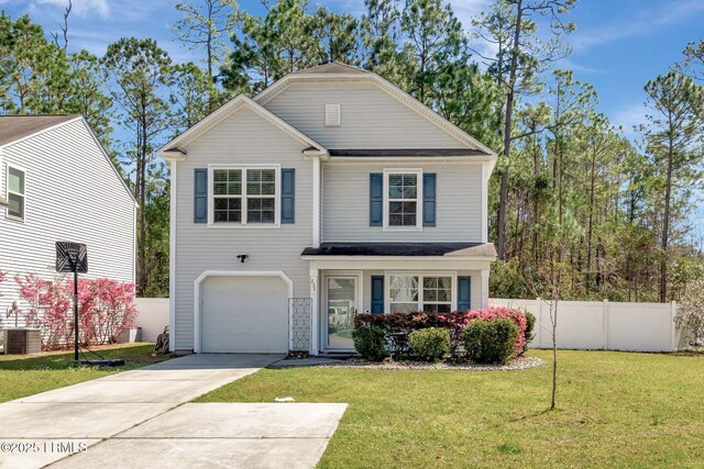 traditional-style home featuring concrete driveway, a front lawn, an attached garage, and fence