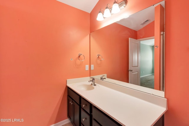 238 Turkey Oak Dr, Bluffton, SC 29910 - bathroom with visible vents, vanity, baseboards, and vaulted ceiling