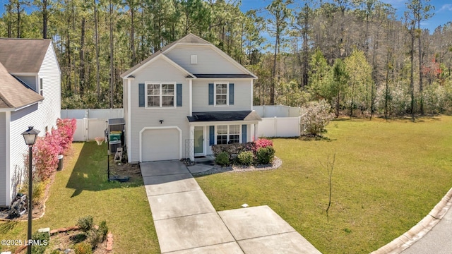 238 Turkey Oak Dr, Bluffton, SC 29910 - traditional-style home with a view of trees, a front yard, driveway, and fence