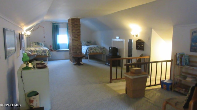 bedroom featuring carpet floors and vaulted ceiling