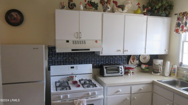 kitchen featuring white cabinetry, sink, white appliances, and exhaust hood