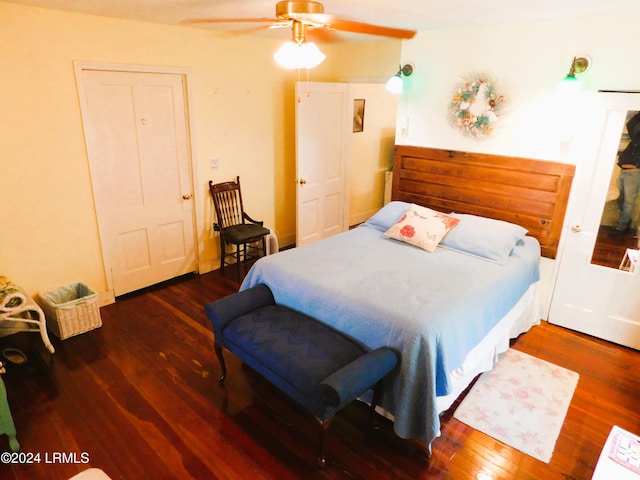 bedroom featuring dark hardwood / wood-style flooring and ceiling fan