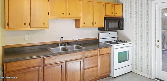 kitchen featuring sink and white gas stove