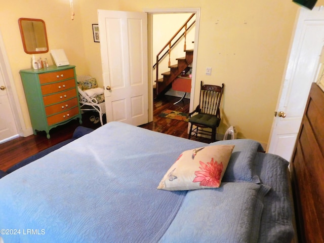 bedroom featuring dark wood-type flooring