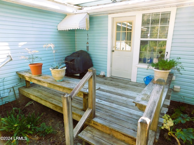 wooden deck with area for grilling