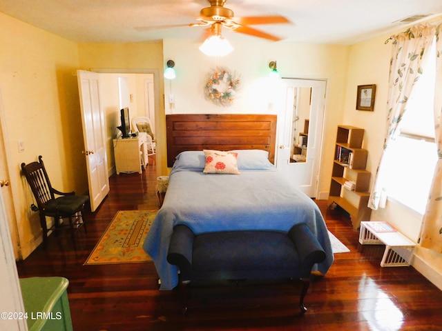 bedroom featuring ceiling fan and dark hardwood / wood-style flooring