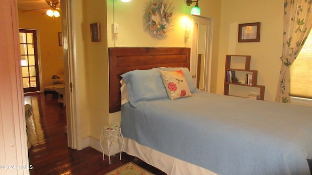 bedroom featuring dark hardwood / wood-style flooring