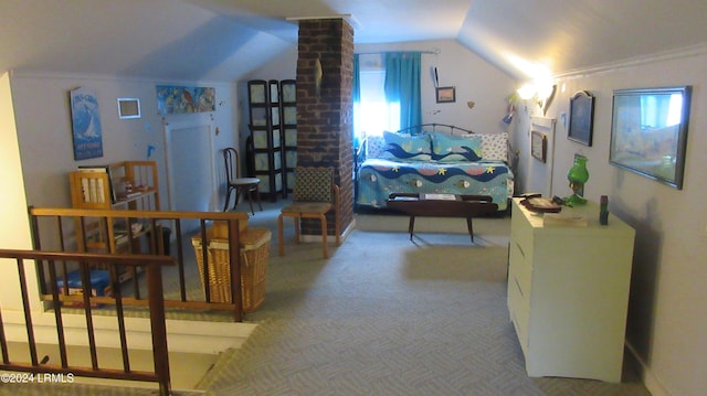 bedroom featuring ornamental molding, lofted ceiling, carpet floors, and decorative columns