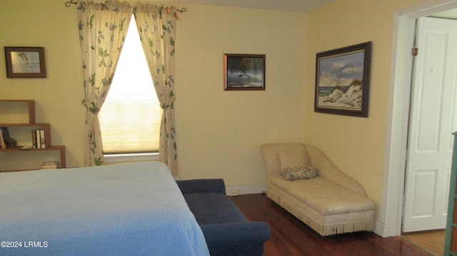 bedroom featuring dark wood-type flooring