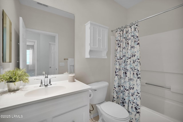 bathroom with toilet, vanity, visible vents, and shower / bathtub combination with curtain