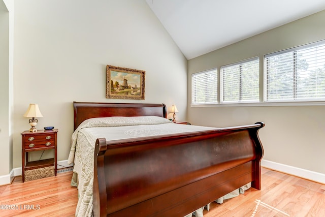 11 Compass Pt Unit 11B, Hilton Head Island, SC 29928 - bedroom with baseboards, wood finished floors, and vaulted ceiling