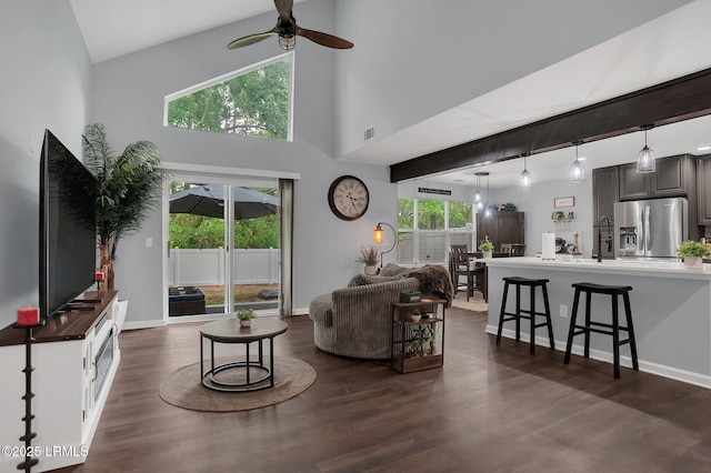 50 Lake Linden Ln Unit 50, Bluffton, SC 29910 - living area featuring ceiling fan, dark wood-style flooring, a high ceiling, and baseboards
