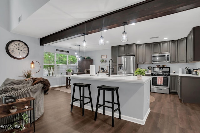 50 Lake Linden Ln Unit 50, Bluffton, SC 29910 - kitchen with stainless steel appliances, a sink, light countertops, dark wood-style floors, and recessed lighting