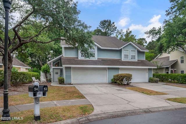 50 Lake Linden Ln Unit 50, Bluffton, SC 29910 - view of front facade with concrete driveway, a garage, and a shingled roof