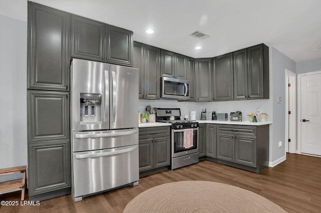 50 Lake Linden Ln Unit 50, Bluffton, SC 29910 - kitchen featuring appliances with stainless steel finishes, gray cabinets, dark wood-style floors, light countertops, and baseboards
