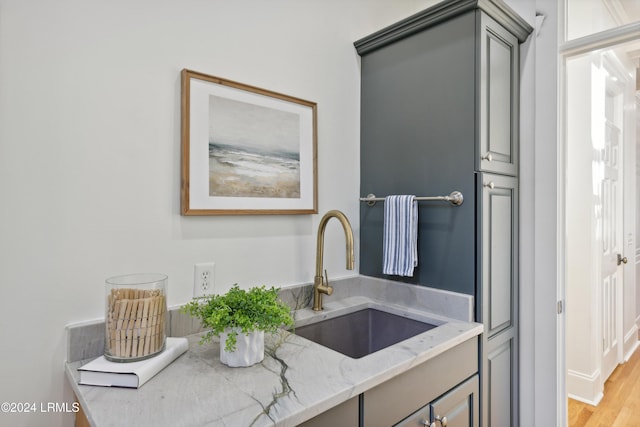 bathroom with vanity and wood-type flooring