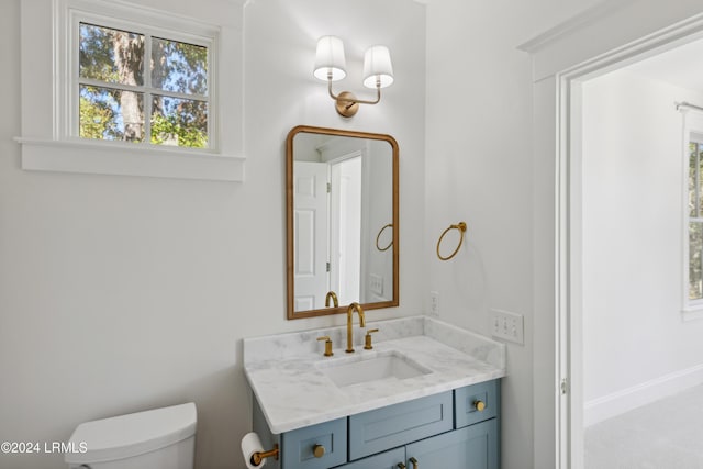 bathroom with vanity and toilet