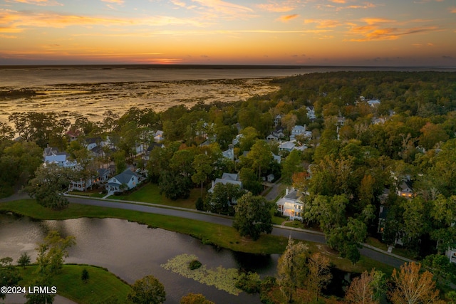 aerial view at dusk with a water view