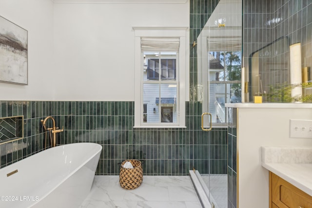 bathroom with vanity, plus walk in shower, and tile walls