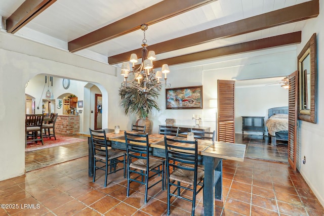 618 Dolphin Anx, Fripp Island, SC 29920 - dining space with beamed ceiling, a chandelier, and arched walkways
