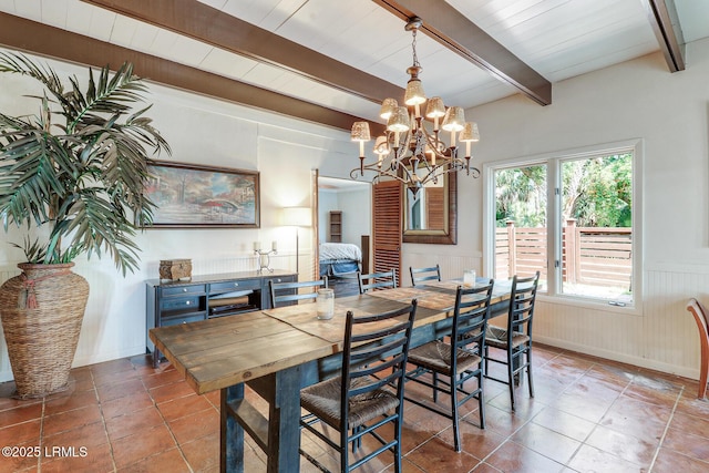 618 Dolphin Anx, Fripp Island, SC 29920 - tiled dining space featuring beam ceiling, a wainscoted wall, and a chandelier