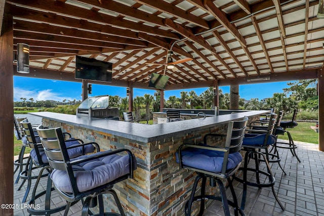 618 Dolphin Anx, Fripp Island, SC 29920 - view of patio / terrace with exterior kitchen and view of wooded area