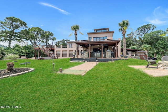 618 Dolphin Anx, Fripp Island, SC 29920 - back of property with a patio, a yard, stairway, stucco siding, and stone siding