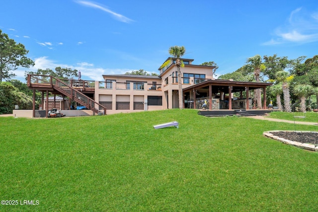 618 Dolphin Anx, Fripp Island, SC 29920 - back of property featuring a yard, stairs, a wooden deck, and stucco siding