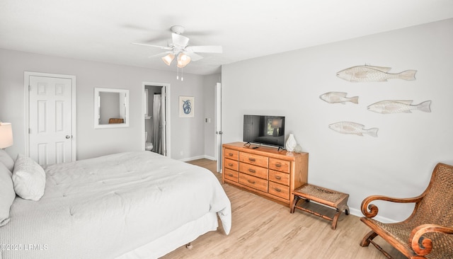 bedroom featuring baseboards, a ceiling fan, and light wood-style floors