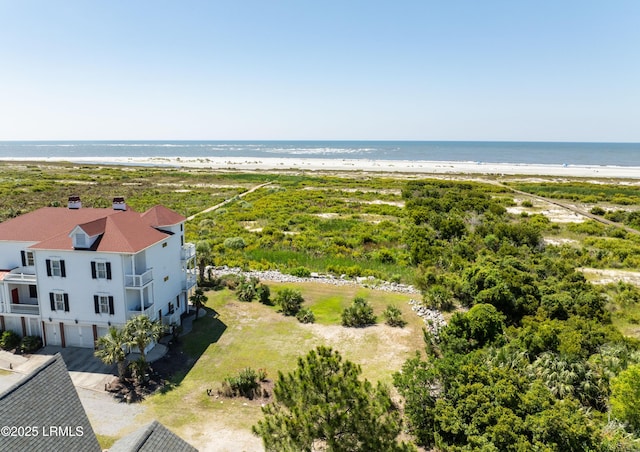 bird's eye view featuring a view of the beach and a water view