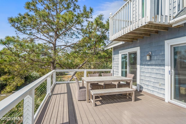 deck with outdoor dining area