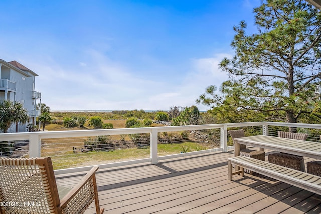 wooden deck with outdoor dining area