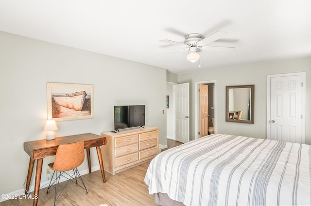 bedroom featuring baseboards, ceiling fan, and light wood-style floors