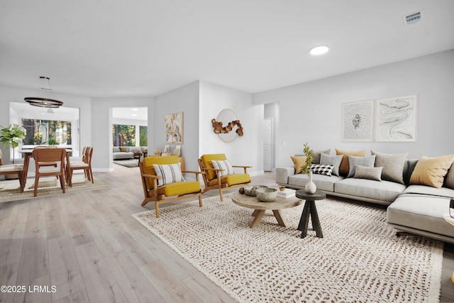 living room with light hardwood / wood-style flooring