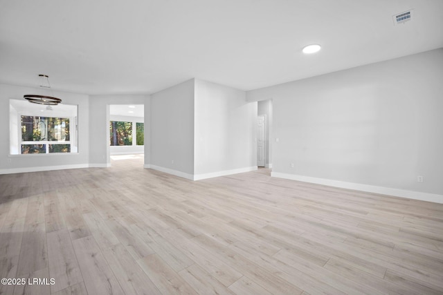 unfurnished living room with light wood-type flooring