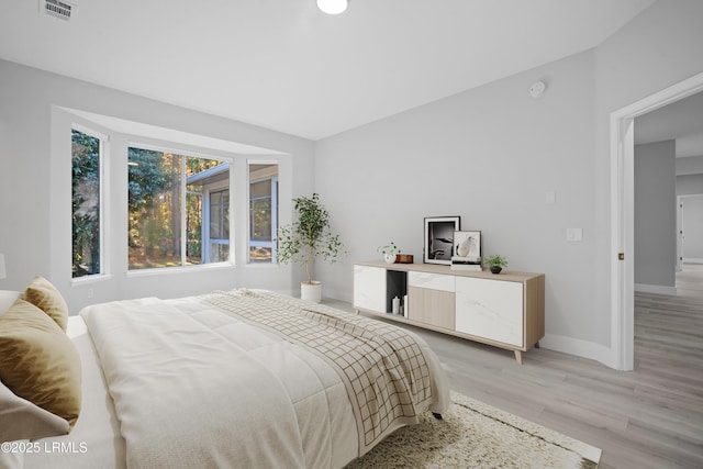 bedroom with light hardwood / wood-style floors