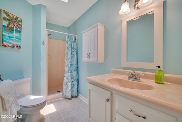 bathroom featuring vanity, tile patterned floors, toilet, and a shower with shower curtain