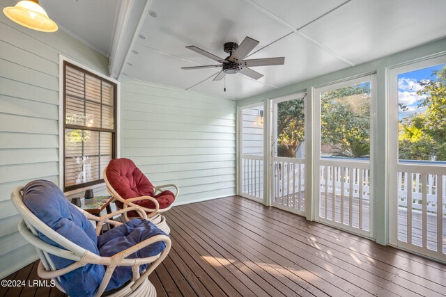 sunroom / solarium with ceiling fan