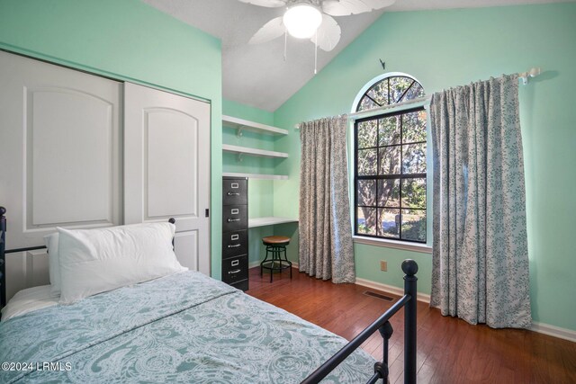 bedroom featuring ceiling fan, lofted ceiling, dark hardwood / wood-style flooring, and a closet