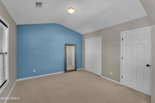 2176 Blakers Blvd, Okatie, SC 29909 - unfurnished bedroom featuring baseboards, visible vents, lofted ceiling, carpet flooring, and a closet